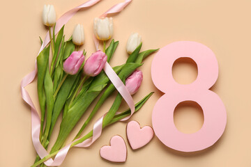 Figure 8 made of paper with tulip flowers and cookies on beige background. International Women's...