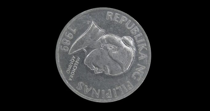 Obverse of Philippines coin 5 sentimo 1989 with portrait of Melchora Aquino, isolated in black background. Seamless animation in 4k resolution video.