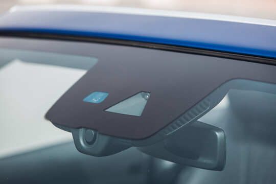 Rain and light sensor on the windshield of the car