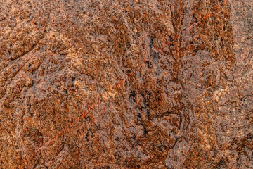 Relief uneven texture of wet rock stone. Abstract background