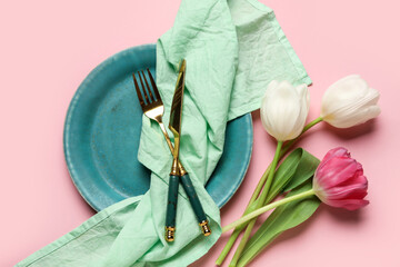 Table setting with beautiful tulips on pink background