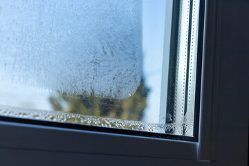 Indoor close-up of a leaky window. Condensate water on window - 769131126