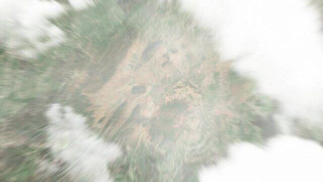 Earth zoom in from space to Goz Beida, Chad. Followed by zoom out through clouds and atmosphere into space. Satellite view. Travel intro. Images from NASA