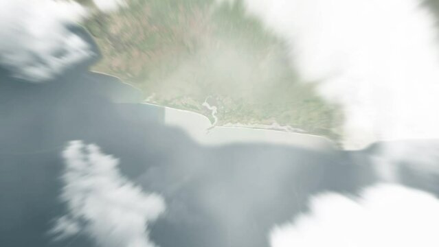 Earth zoom in from space to Harper, Liberia. Followed by zoom out through clouds and atmosphere into space. Satellite view. Travel intro. Images from NASA