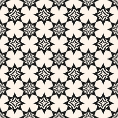 Vector abstract geometric seamless pattern. Simple elegant ethnic texture with ornamental grid, flower shapes, stars, lattice. Tribal ethnic motif. Black and white folk style background. Repeat design