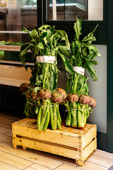 Artichoke fruits and greens on the store counter