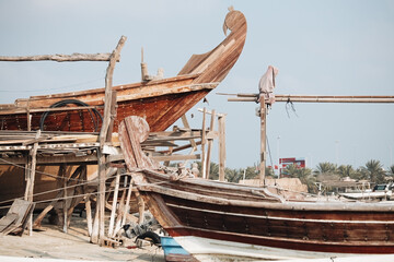 Fototapeta na wymiar Boats and cityscpae view in the fisherman's bay in Manama Bahrain