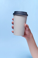 Hand Holding a Coffee Cup: Morning Brew Delight