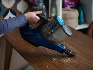 girl cleaning the house with a vacuum cleaner