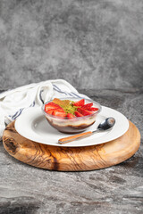 Strawberry magnolia dessert. Strawberry pudding dessert on wooden serving board. Famous dishes of Turkish cuisine