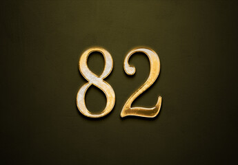 Old gold effect of 82 number with 3D glossy style Mockup.	