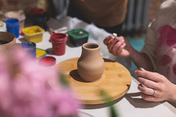 Pottery lesson master class for kids children, process of making clay pot on pottery wheel, potter hands creating ceramic crockery handcrafts, ceramist molding and painting jar or vase