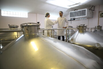 Winemaker working in modern large winery factory drink industry  and  testing wine in a wine factory warehouse - 769182153