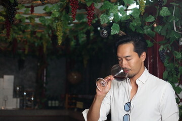 handsome man sommelier tasting red wine - 769182377