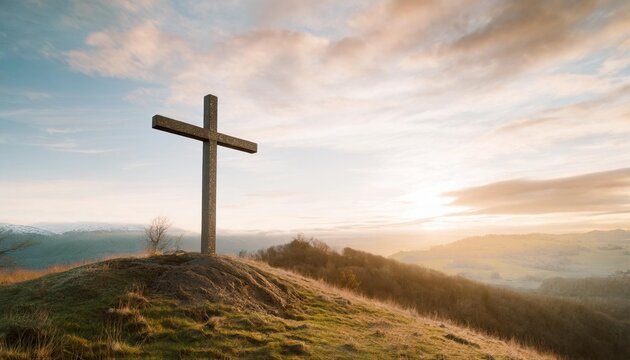 christian cross on hill outdoors at sunrise resurrection of jesus concept photo