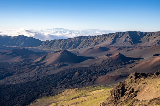 Looking down into the crater of Haleakalā Volcano, or the East Maui Volcano, which is a massive shield volcano that forms more than 75% of the Hawaiian Island of Maui. 