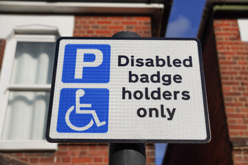Disabled badge holders only sign for parking space in the UK. 