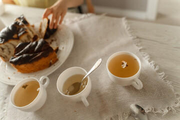 Table Set With Two Tea Cups and Plate of Food