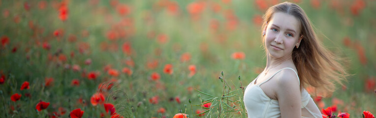 Blooming Beauty: A Girl Amidst the Lushness of Poppies