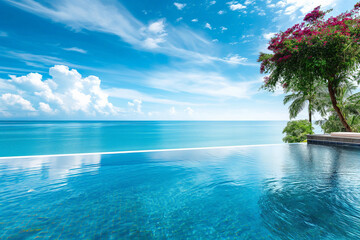 Tranquil Infinity Pool Overlooking the Serene Ocean Under a Blue Sky with Wispy Clouds
