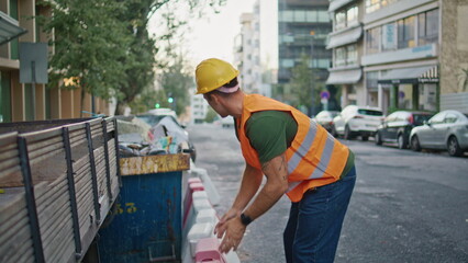 Urban foreman working street putting enclosure at morning town. Builder man