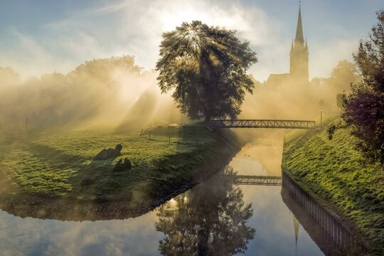 Morning fog old harbour Weser and catholic church, Rinteln, Germany, Europe