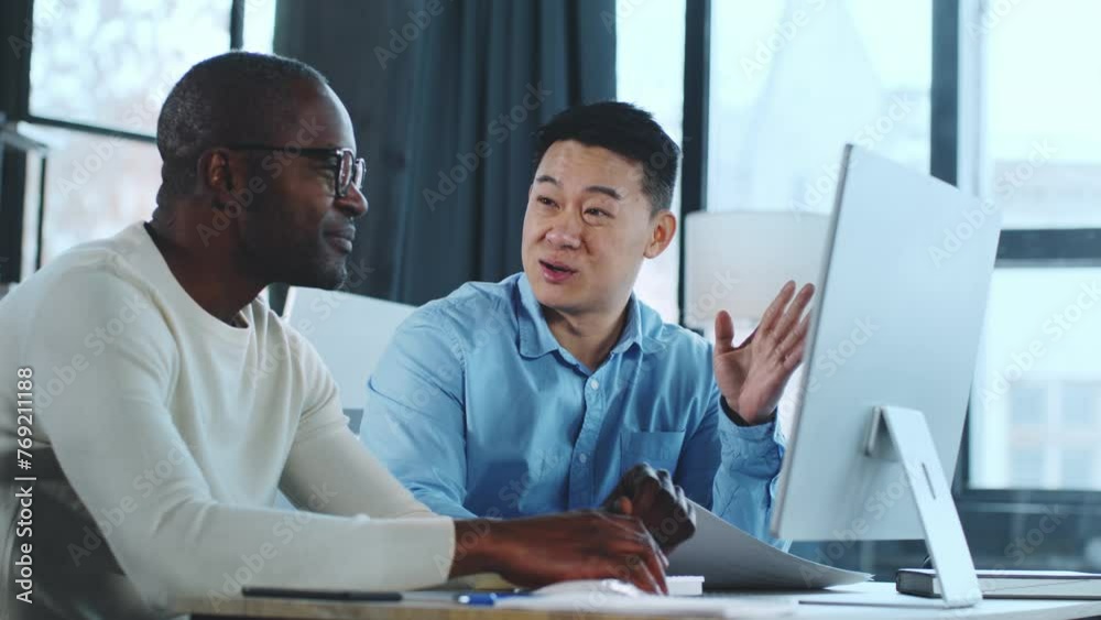 Poster two men working at computer
