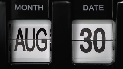 retro flip calendar with a date change from the twenty-ninth of August to the thirtieth of August. daily calendar with a change of days of the month. close up.