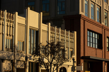 Sunlight light shines on historic downtown buildings of Redwood City, California, USA.