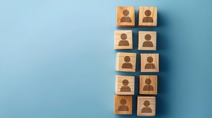 Building a Strong and Cohesive Team: Human Resources Concept with Wooden Blocks and People Icon on Blue Background