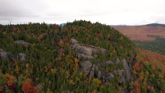 Aerial Epic Wide Girl Standing on Mountain Fall Foliage
