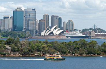 Sydney skyline with opera house ,cruise ship and harbour ferry.