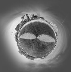 panorama of Spreebogen park in Berlin with government buildings in Berlin in early morning light in tiny planet format