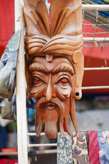 classic and unique traditional masks hanging in a market stall