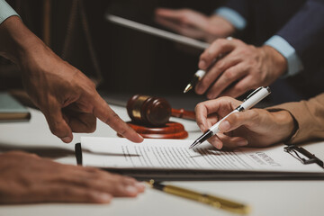 A group of lawyers and clients are discussing the contract they will be signing together in the future, Collaborative brainstorming between lawyers and clients