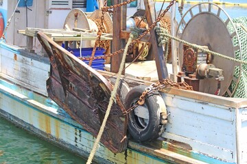 The side of an old fishing trawler - boat. Docked at sydney fish markets