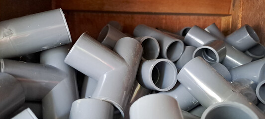 PVC pipe with thread, Coupling for pipes, Pipe fitting. Pumping compressor pipes on a white...