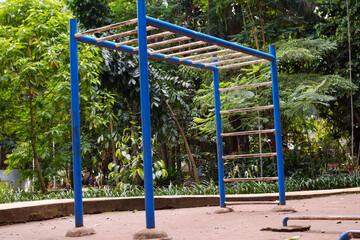 Outdoor sports field. empty colorful monkey bars workout in city park - obrazy, fototapety, plakaty
