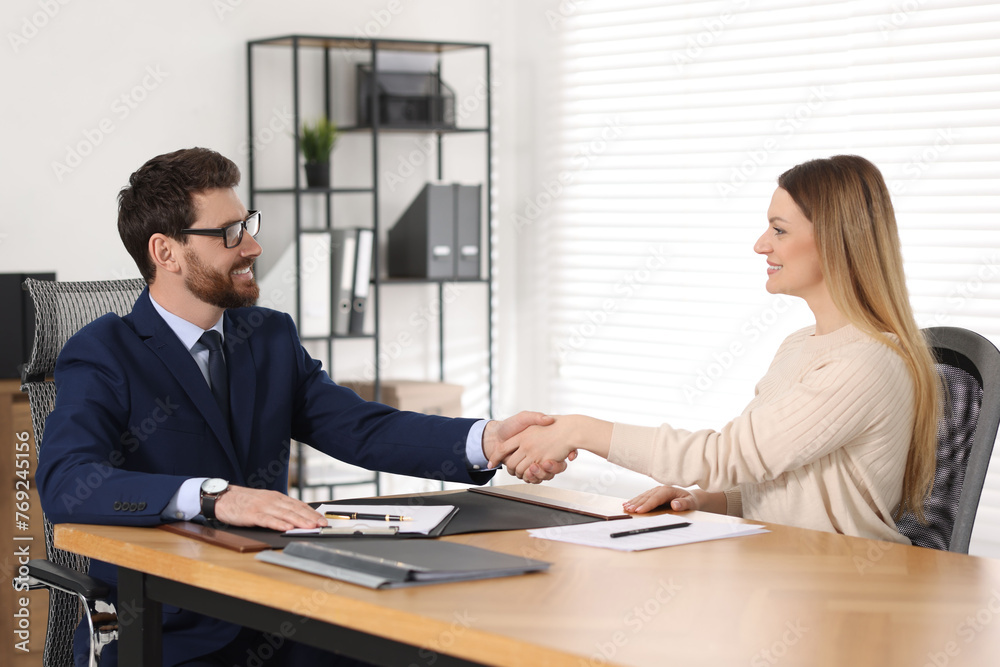 Sticker Lawyer shaking hands with client in office