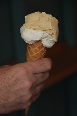Man holding ice cream cone - 769249902