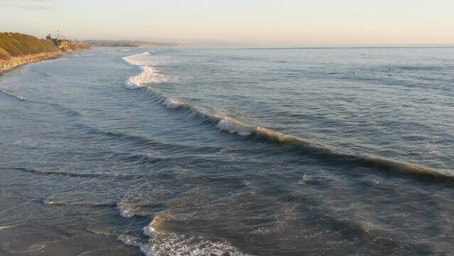 A mix of Southern California beach scenes with sunsets, surfers, tide pools and palms trees at Swamis Reef Surf Park and Moonlight Beach in Encinitas California.