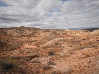 Fototapeta na wymiar Four wheel drive road through beautiful red desert landscape in St. George utah