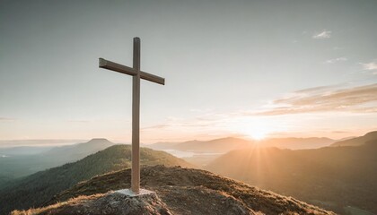 cross on top of a mountain at sunset - obrazy, fototapety, plakaty