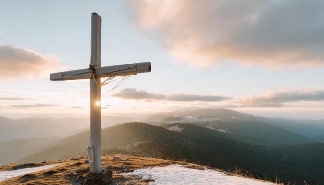 wooden cross on the top of the mountain on new year s eve or christmas