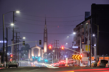Inglewood, California, USA - October 7, 2022: Evening traffic passes through historic downtown...