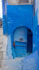 Arched entrance in an alley in the medina in Chefchaouen, Morocco