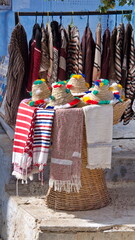 Vendor selling colorful hats in the medina in Chefchaouen, Morocco