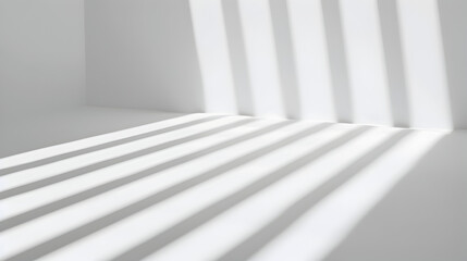 Natural light rays casting minimal shadows on white wall.