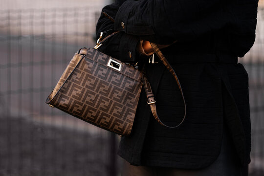 Milan, Italy - January, 13, 2024: man wears Fendi bag, street style details, fashion outfit detail