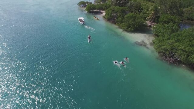 Flying over and around ocean and various boats in Belize